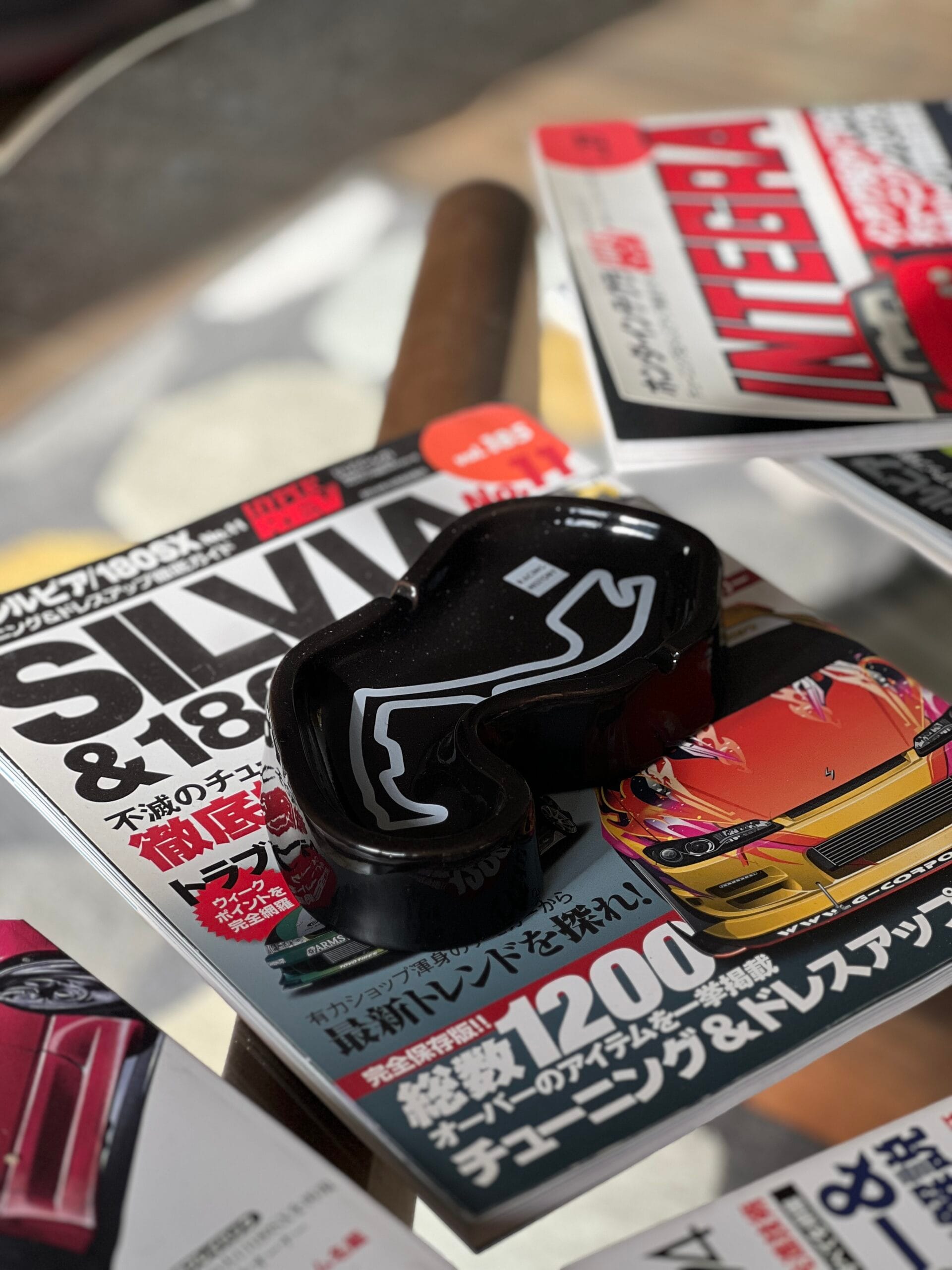RH Ashtray on magazines